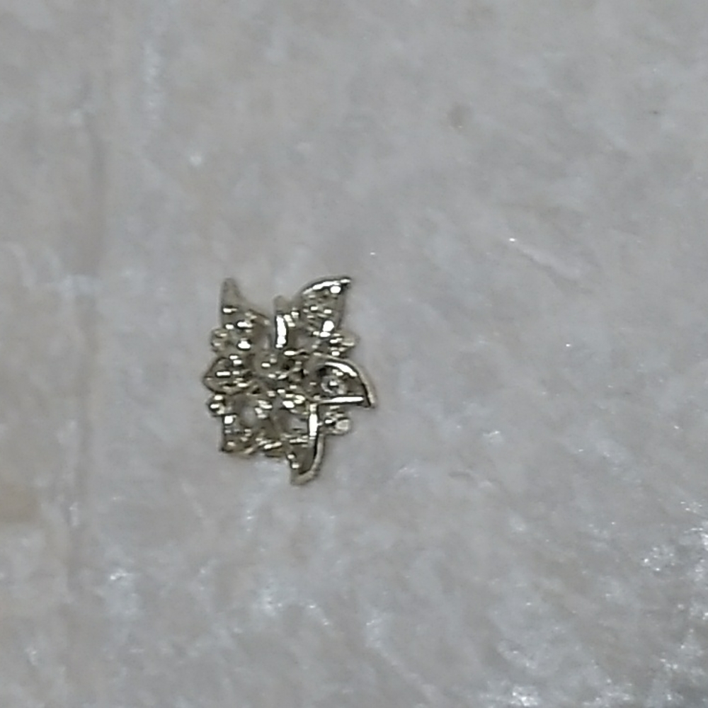 A gold toned brooch